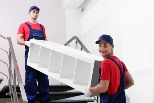 Removal team packing and loading furniture for a Bermondsey home