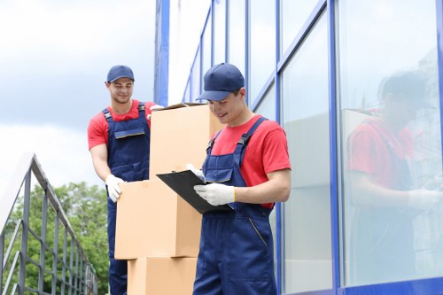 Removal team loading household items into a moving van