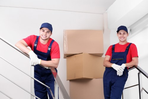 Removal staff assessing risks and access before loading items