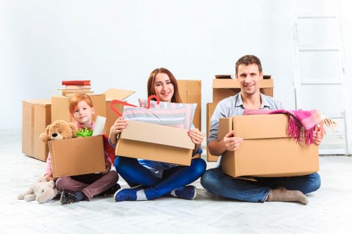 Packed boxes and moving equipment prepared for a local house move