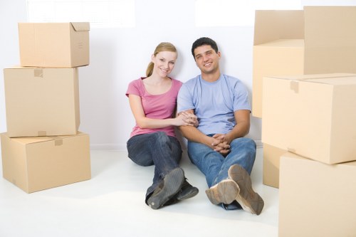 Removals crew handling belongings in an urban Bermondsey property