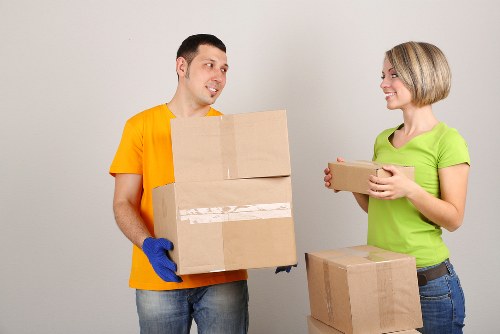 Professional movers handling furniture during a relocation