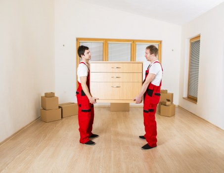 Packed moving boxes and furniture ready for collection in Bermondsey
